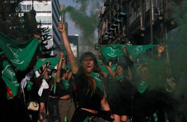 Activists, part of a movement known as «Marea Verde» take part in a performance to film a message to spread awareness during the International Safe Abortion Day in Mexico City