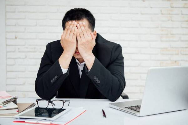 Business man unhappy businesspeople sitting in office